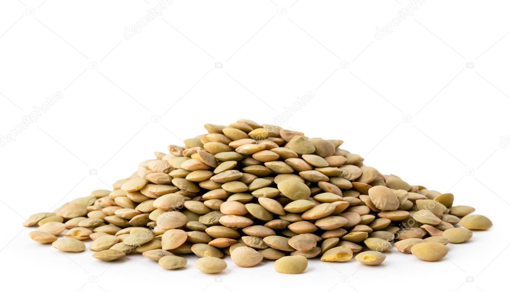 Heap of dry lentils closeup on a white. Isolated.