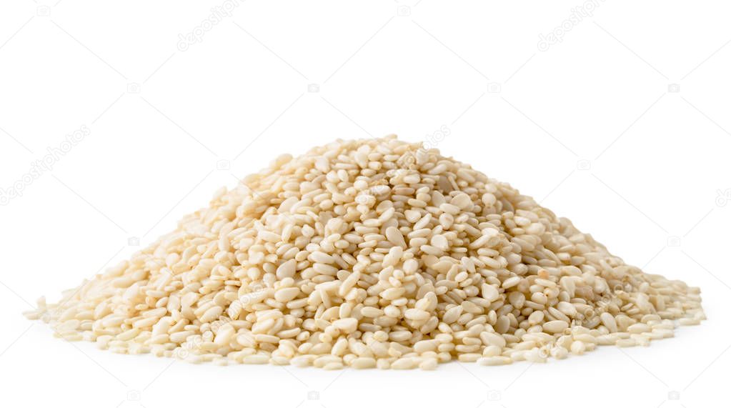 Heap of sesame seeds close up on a white. Isolated.