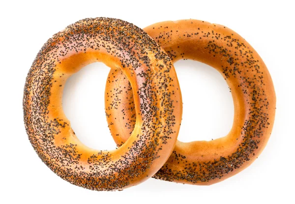 Dois bagels com sementes de papoila em um branco. A forma do topo . — Fotografia de Stock