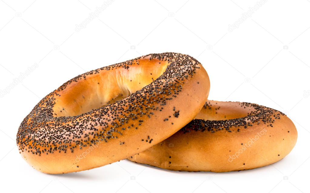 Two bagels with poppy seeds close - up on a white. Isolated.