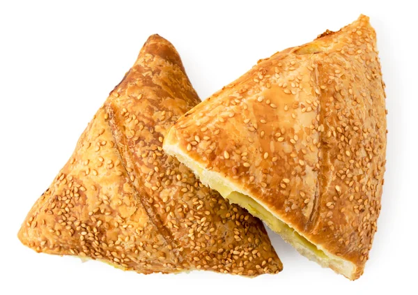 Two buns puffs with sesame seeds on a white. The form of the top. — Stock Photo, Image