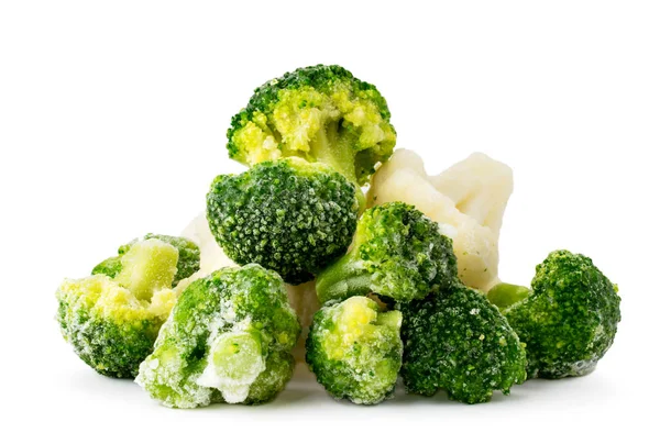 Heap of frozen broccoli and cauliflower close-up on a white. Isolated. — Stock Photo, Image