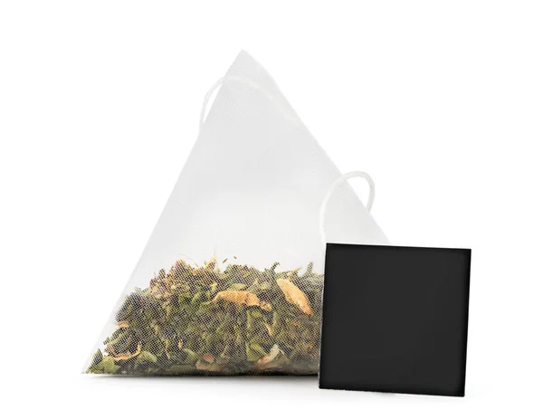 Green tea bag with tag on a white background. Isolated