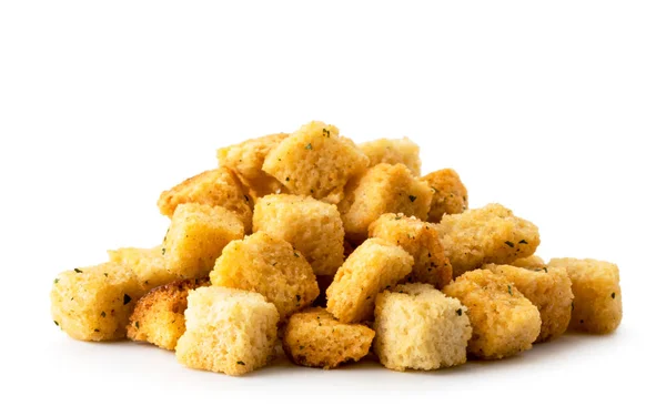 Heap crispy bread crackers close-up on a white. Isolated. — Stock Photo, Image