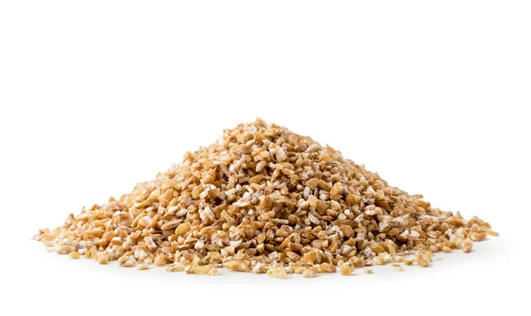 Heap of dry wheat groats on a white background, isolated. — Stock Photo, Image