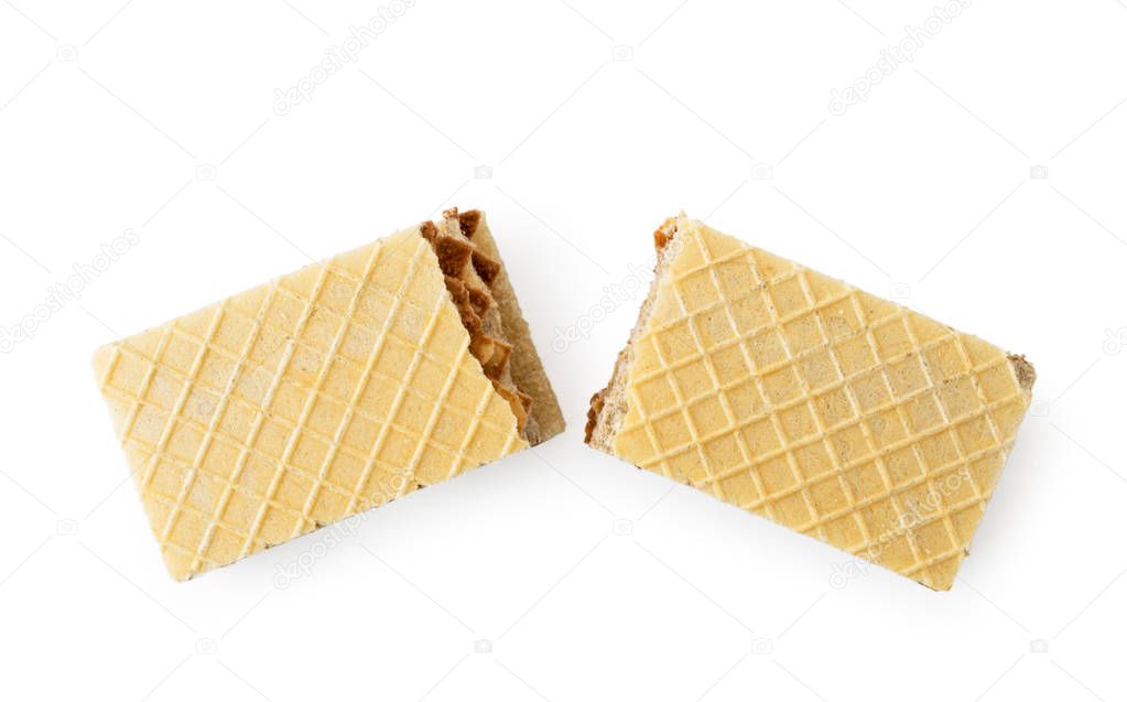 Waffle biscuits broken in half on a white. The form of the top.