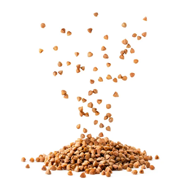 Buckwheat seeds fall in a pile on a white, isolated. — Stock Photo, Image