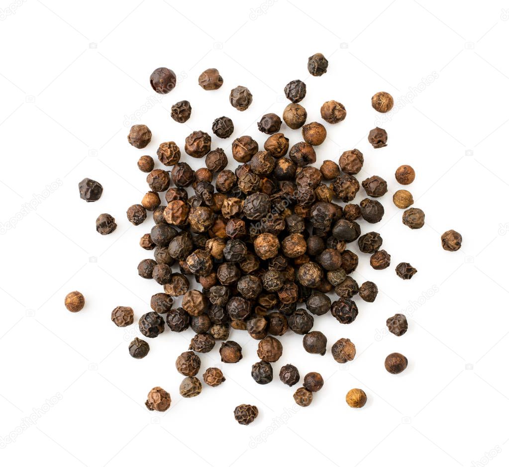 Pile of black pepper peas on a white background. The view of the top.