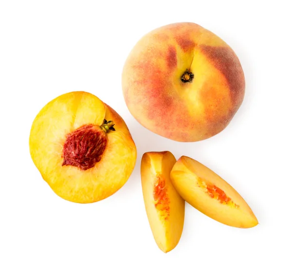 Peach, half with a bone and two pieces on a white. The view of the top. — Stock Photo, Image