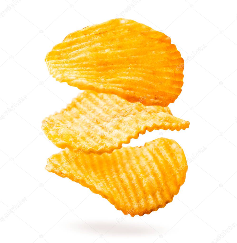 Potato chips are fluted falling on a white, isolated.