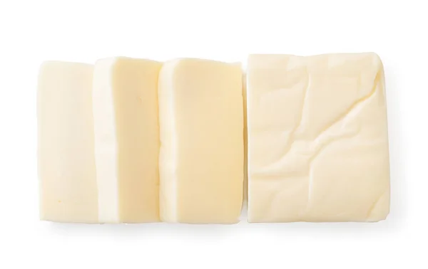Сливочный сыр прямоугольной формы на белом. Вид сверху . — стоковое фото