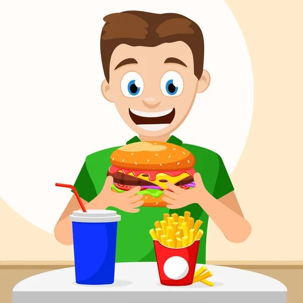 Mężczyzna trzyma hamburgera i uśmiecha się szczęśliwie, siedzi przy stole z frytkami i pije. — Wektor stockowy