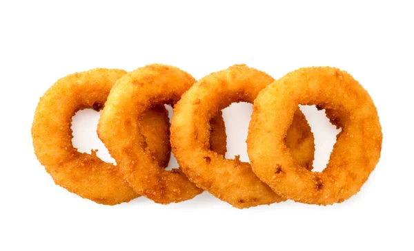 Onion rings lie flat on a white background. The view of the top. — Stock Photo, Image