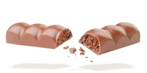 Chocolate Poroso Rompe Vuela Cerca Sobre Fondo Blanco Aislado — Foto de Stock