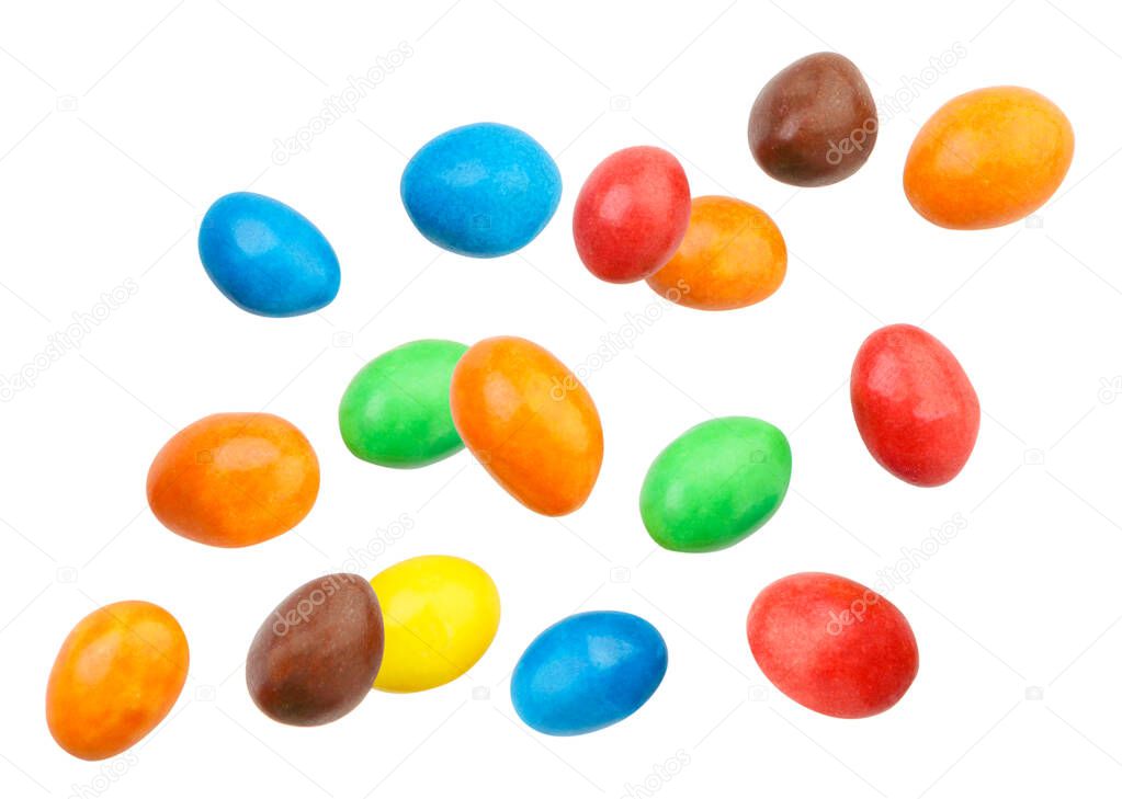 Candy peanuts covered with chocolate in a multicolored glaze fly close-up on a white background. Isolated