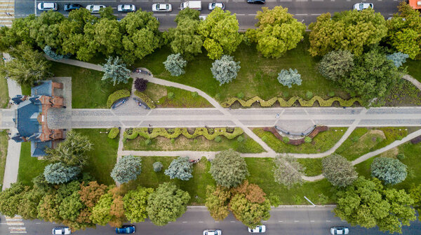 Aerial view from above of the vehicular intersection,  traffic at peak hour with cars on the road.