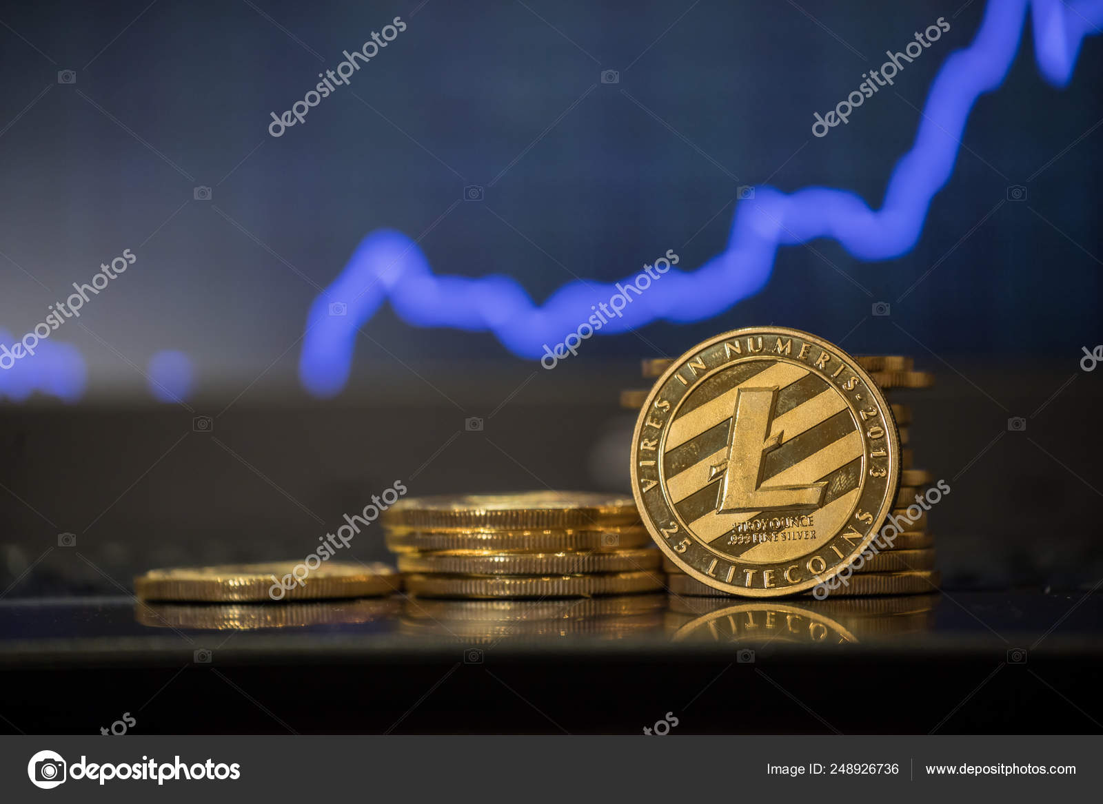 Golden Lightcoin on defocused blue chart background. — Stock Photo ©  shok-design #248926736