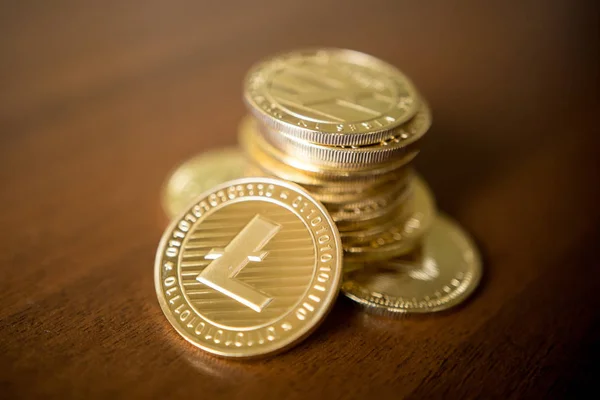 Business concept of crypto currency. Golden Lightcoin on us dollars close up. — Stock Photo, Image