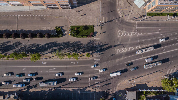Aerial view of the vehicular intersection, traffic at peak hour with cars on the road