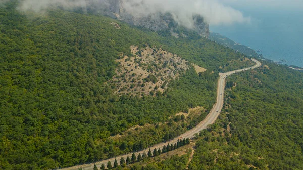 Crimean roads: aerial view of curvy mountain road in summer day — Stock Photo, Image