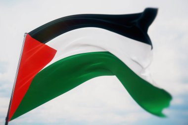 Dünyanın bayraklarını sallıyordu. Filistin bayrağı. Sığ bir alan derinliği ve seçici bir odak noktasıyla vurulmuş. 3B illüstrasyon.