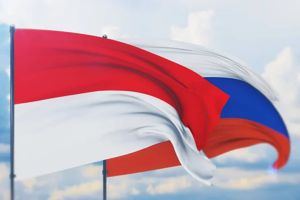 Размахивая флагом России и Индонезии. Вид крупным планом, 3D иллюстрация. — стоковое фото