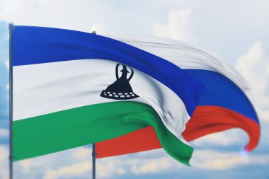 Rus bayrağı ve Lesotho bayrağı sallıyordu. Yakın görünüm, 3 boyutlu illüstrasyon.