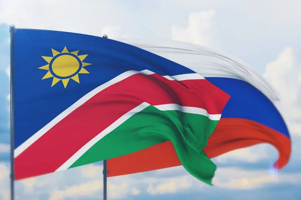 Zwaaiende Russische vlag en vlag van Namibië. Close-upweergave, 3D-illustratie. — Stockfoto