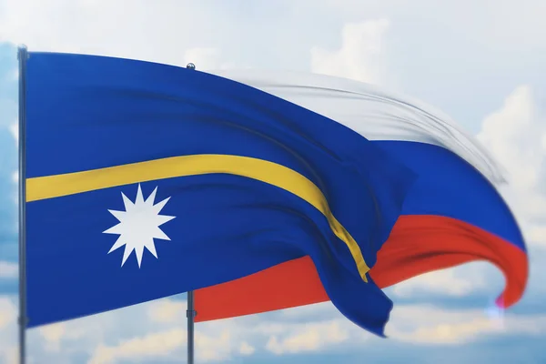 Rus bayrağı ve Nauru bayrağı sallıyordu. Yakın görünüm, 3 boyutlu illüstrasyon. — Stok fotoğraf