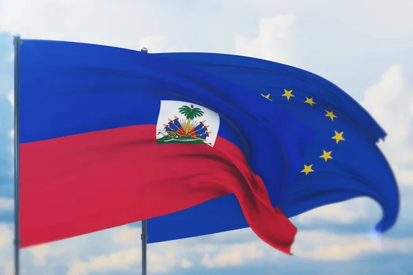 Waving European Union flag and flag of Haiti. Closeup view, 3D illustration. — Stock Photo, Image