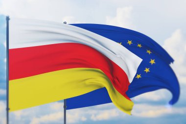 Avrupa Birliği bayrağı ve Güney Osetya bayrağı sallıyordu. Yakın görünüm, 3 boyutlu illüstrasyon.