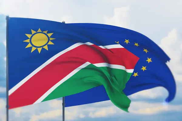 Zwaaiende vlag van de Europese Unie en vlag van Namibië. Close-upweergave, 3D-illustratie. — Stockfoto