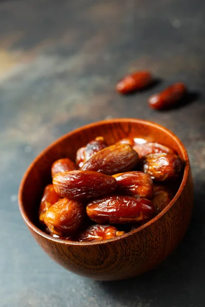 Dried Medjoul date fruit in bowls,  Delicious dried fruit
