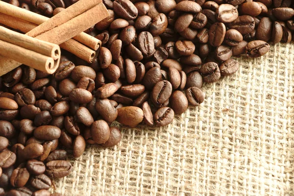 Roasted Coffee Beans Brown Burlap Background Spicy Cinnamon Sticks Copy — Stock Photo, Image