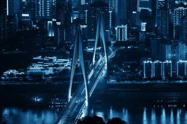 Bridge and city urban architecture at night in Chongqing, China clipart