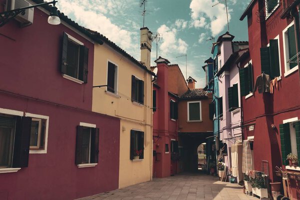 Street view of Burano colorful historical buildings, Venice, Italy.
