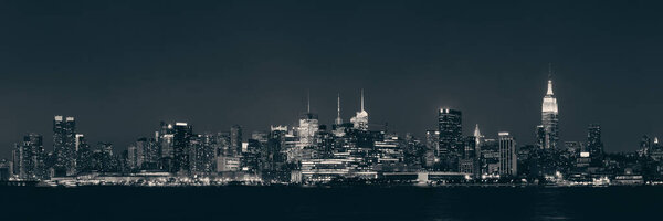 Midtown Manhattan skyline at dusk over Hudson River