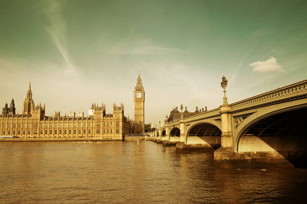 Big Ben and House of Parliament in London panorama over Thames River.