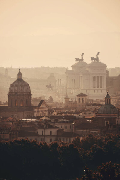 Rome rooftop view at sunrise silhouette with ancient architecture in Italy.