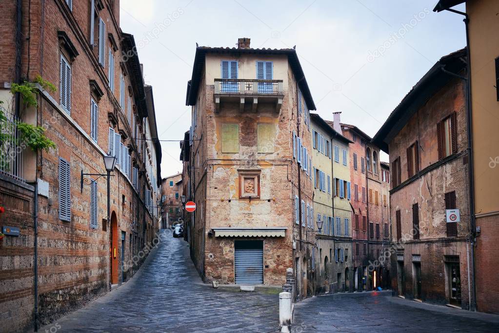 Street view with old buildings in Siena, Italy.