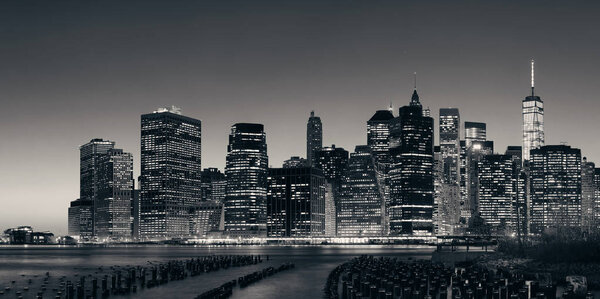 New York City downtown skyline panorama with pier remains at dusk