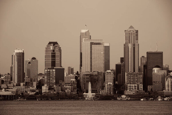 Seattle city skyline view over sea with urban architecture.