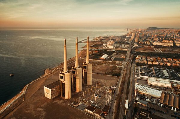Besos thermic power plant aerial view at sunrise in Barcelona coast Spain.