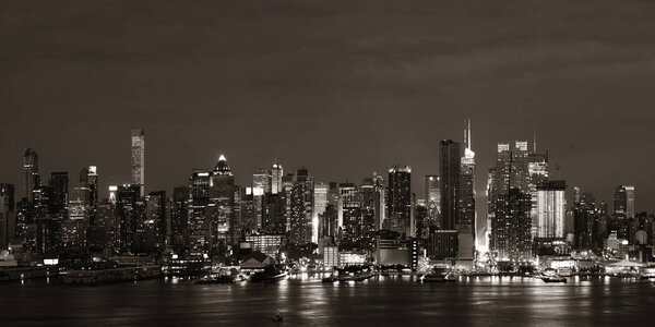 Manhattan midtown skyscrapers and New York City skyline at night panorama