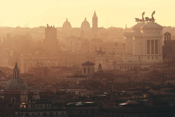 Rome rooftop view at sunrise silhouette with ancient architecture in Italy.