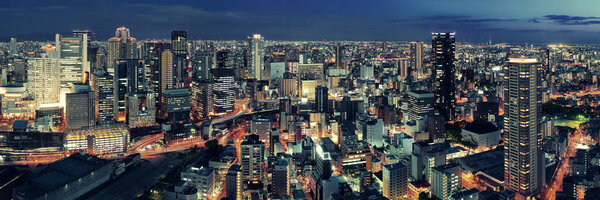 Osaka urban city at night panorama rooftop view. Japan.