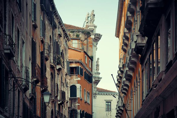 Statue on roof of historical buildings in Venice, Italy.