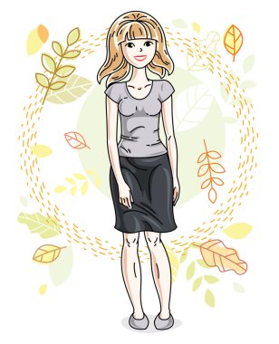 Sonbahar manzara arka plan üzerinde duran ve şık rahat kıyafetler giymiş çekici genç sarışın kadın