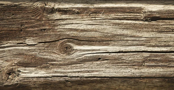 Old rich brown wood grain texture background with knots