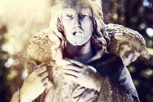 Ancient statue of Jesus Christ - the Good Shepherd. Retro filter. (art composition, details)